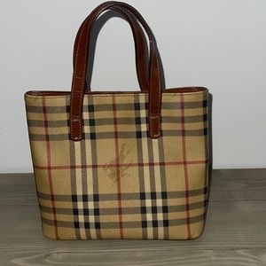 Authentic Burberry mini tote bag with snap closure.